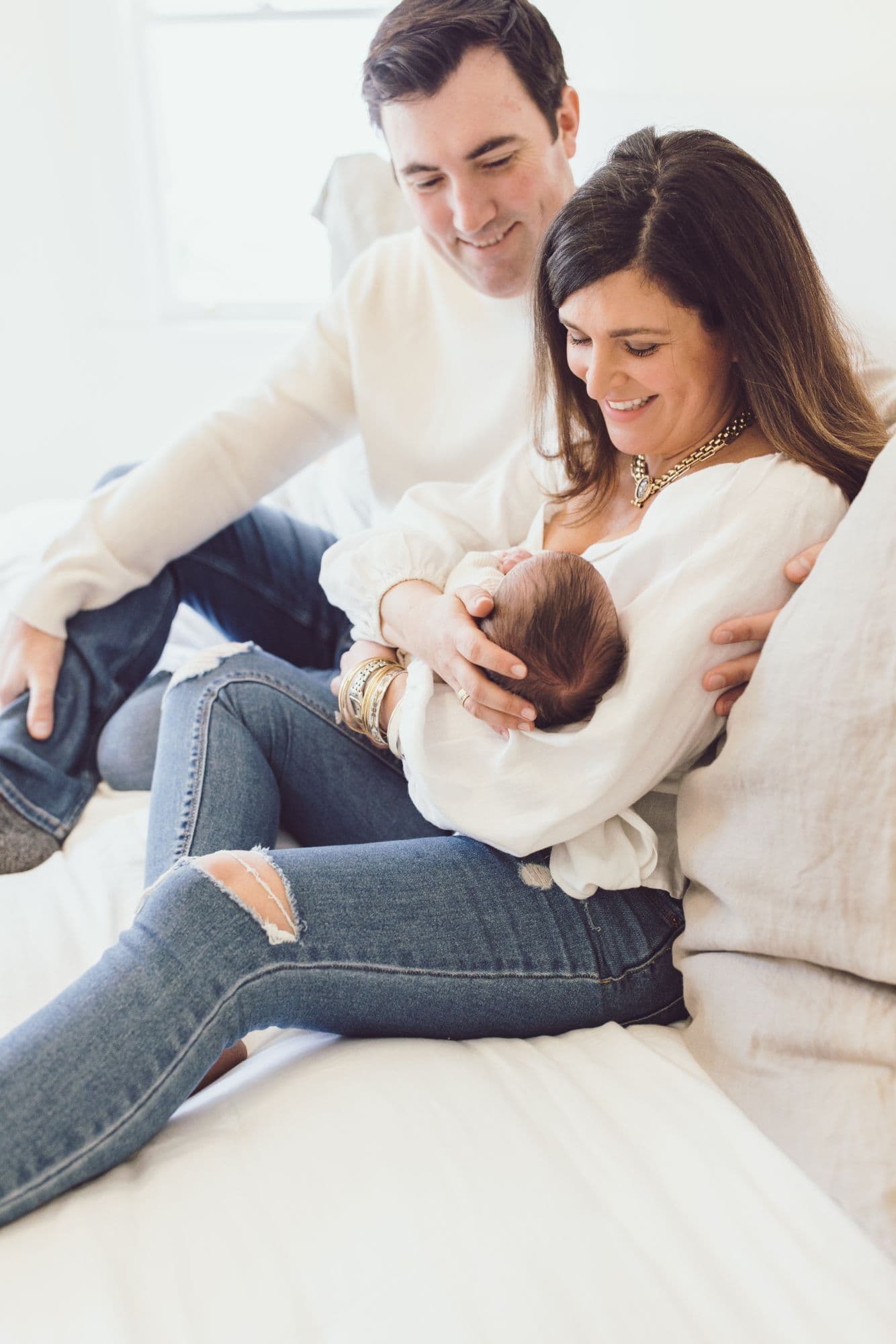 Sleeping newborn baby in cream knit outfit by San Francisco photographer