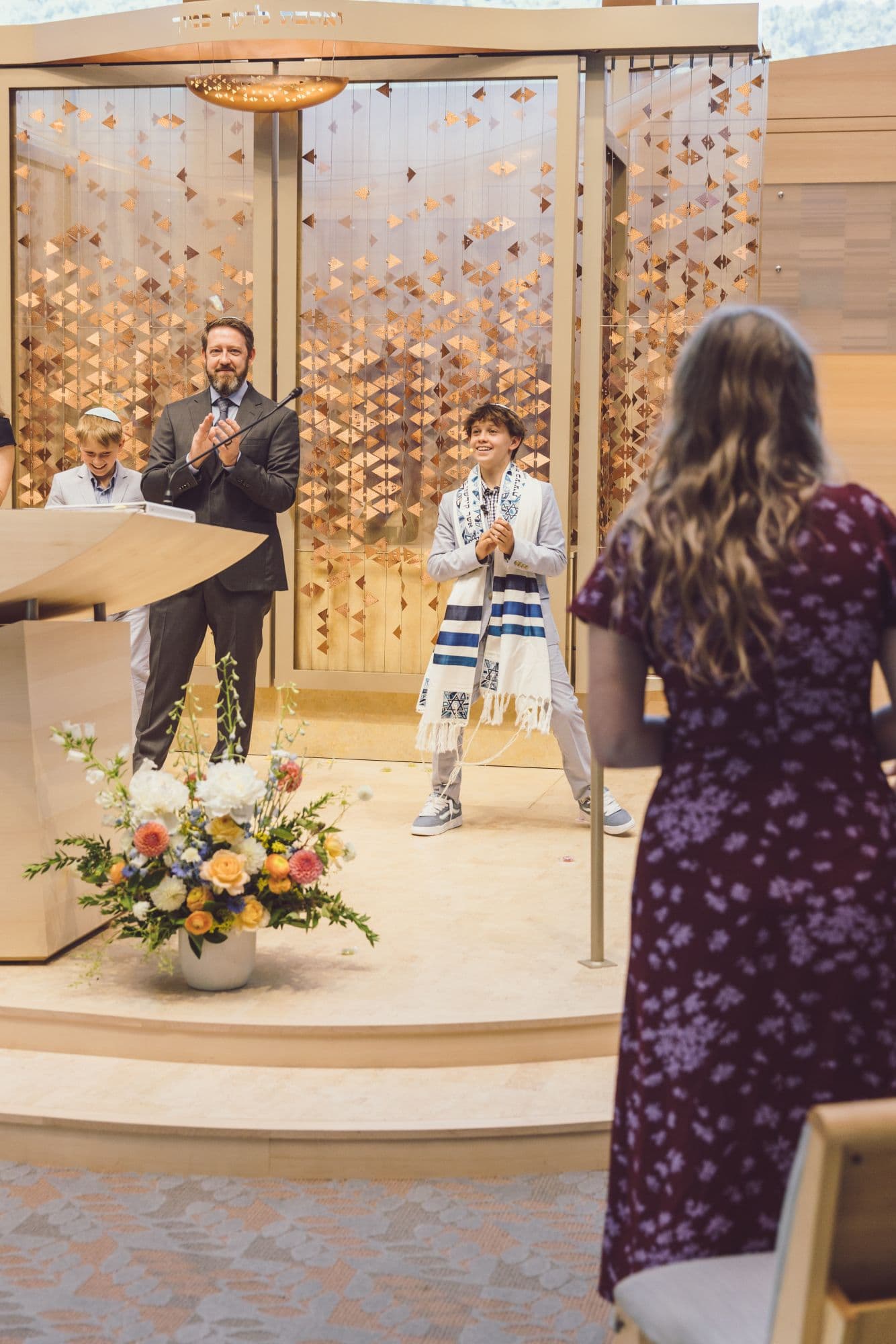San Francisco Bar Mitzvah photographer captures Torah reading ceremony with celebrant at bimah
