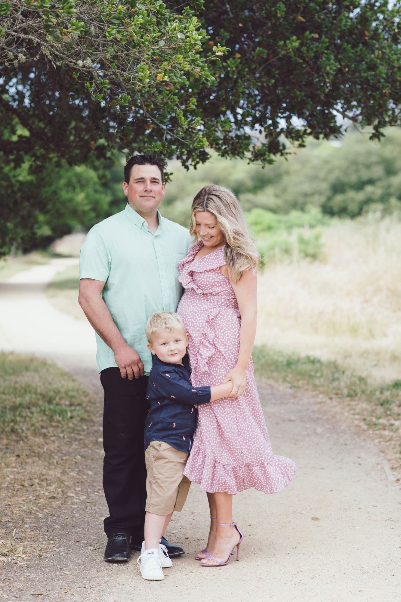 Family with expecting mother and toddler during outdoor San Francisco session
