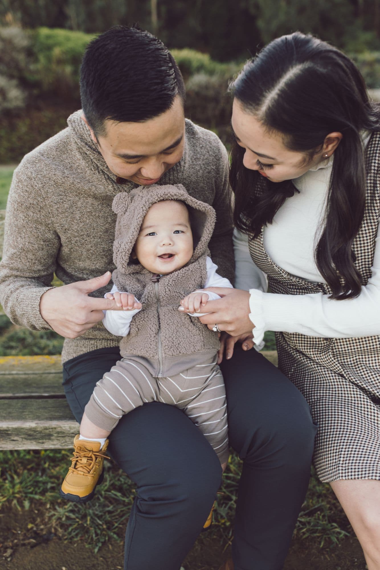 Family photo session at Crissy Field in San Francisco with parents holding their baby