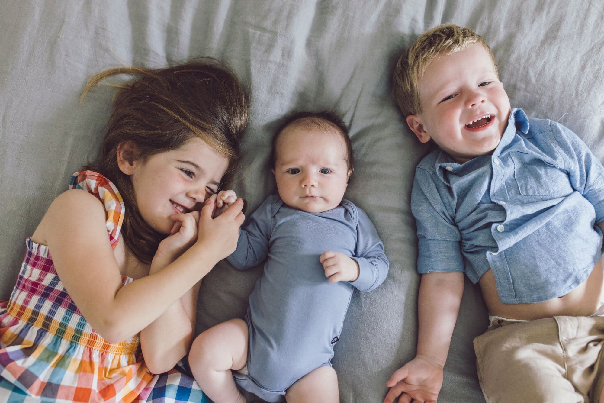 Sibling portrait with newborn baby and two older children in San Francisco